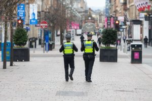 Glasgow, Scotland, UK. 26th Mar, 2020. Coronavirus lockdown Glasgow, Scotland: police patrolling the alamost deserted streets in Glasgow city centre at lunchtime Credit: Kay Roxby/Alamy Live News