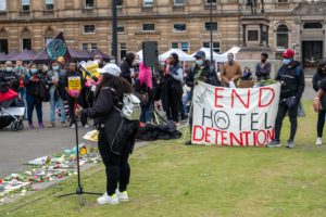 Glasgow, Scotland, UK. 26th June, 2021. On the anniversary of the events at The Park Inn Hotel members of Refugees For Justice gather in George Square to commemorate people seeking asylum who lost their lives during lockdown. Credit: Skully/Alamy Live News