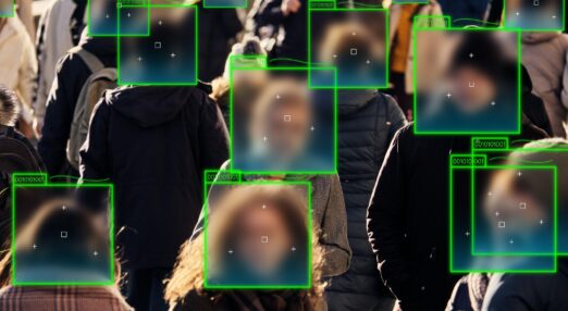 Pedestrians on a busy street with faces being scanned by facial recognition technology.