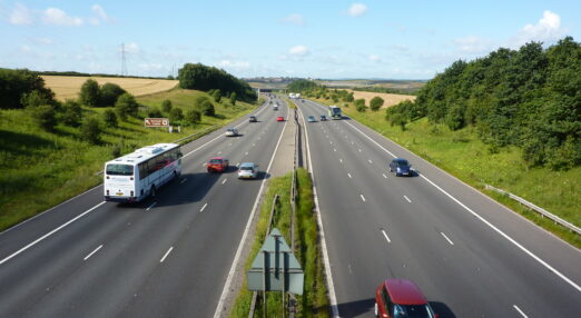 Cars travelling on the M1 motorway as seen from a footbridge