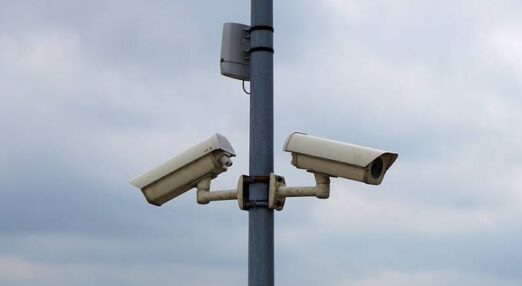 A lamppost with cameras attached to it