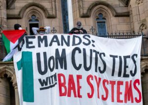 Pro Palestinian Banner with demands on Whitworth tower occupied by students Manchester University. Palestine Gaza war protests in Manchester UK. Protesters  marched from St Peter's Square to the Manchester University where students have occupied the Whitw